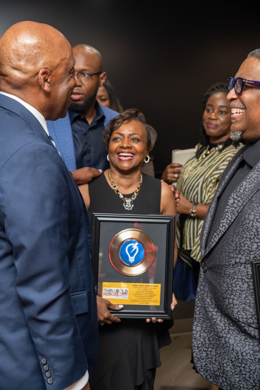 Wanda Willis holding her Think Bold Honors award