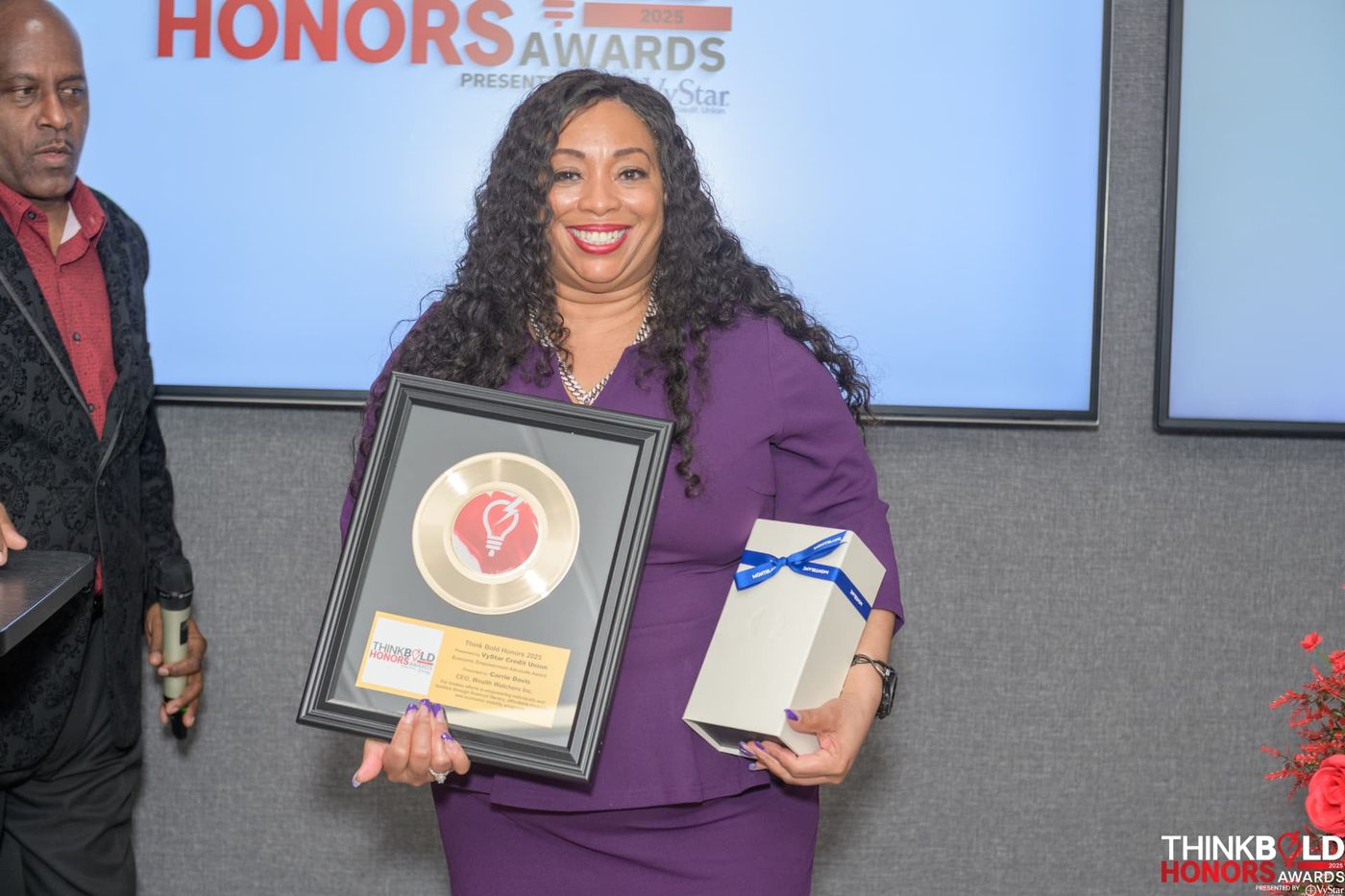 Carrie Davis receiving the Economic Empowerment Advocate Award