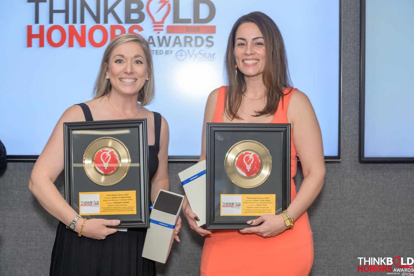 Shannon Schott & Belkis Plata receiving the Justice and Advocacy Trailblazer Award