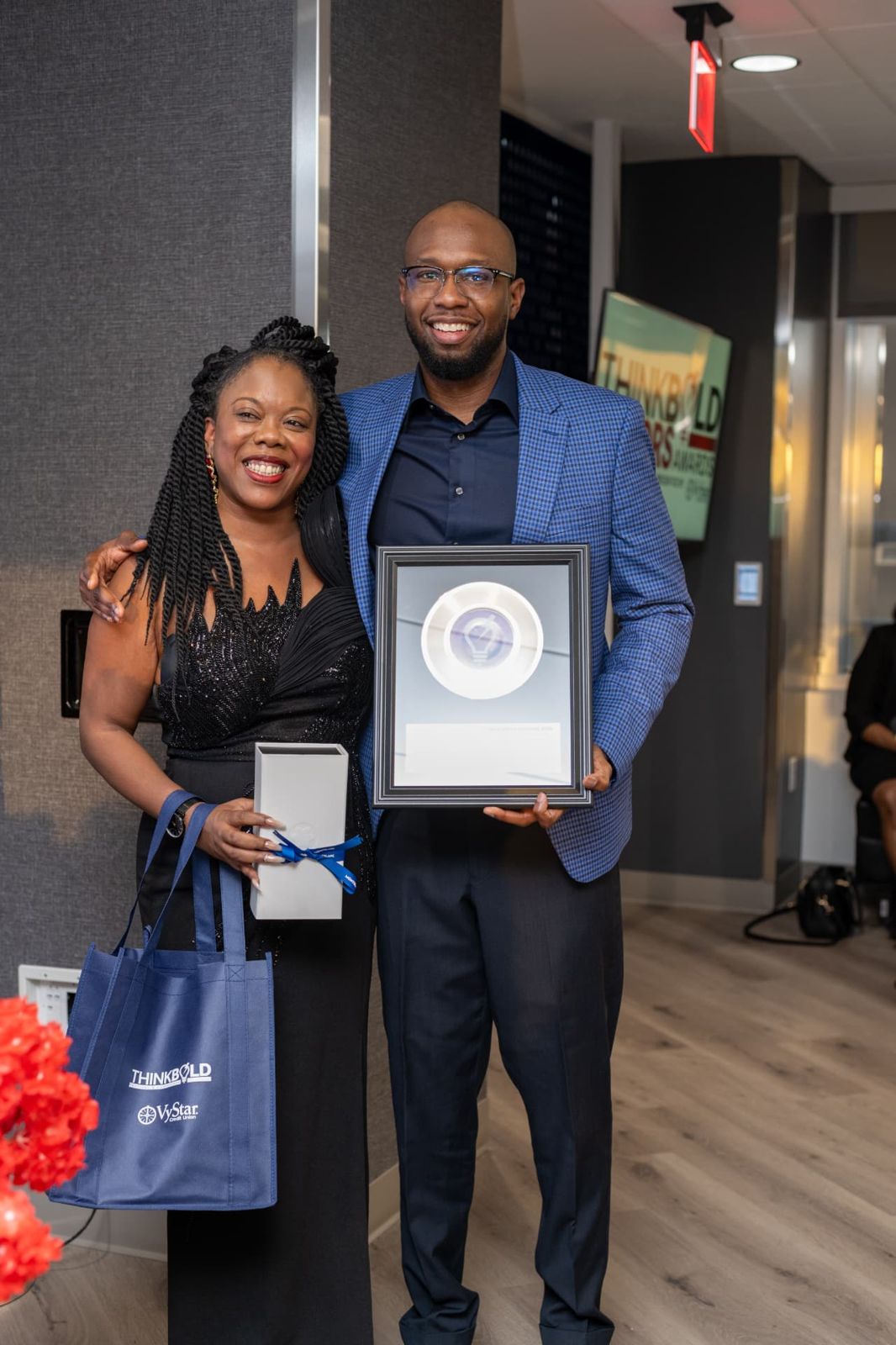 Travis Williams receiving the Neighborhood Transformation & Anti-Poverty Award