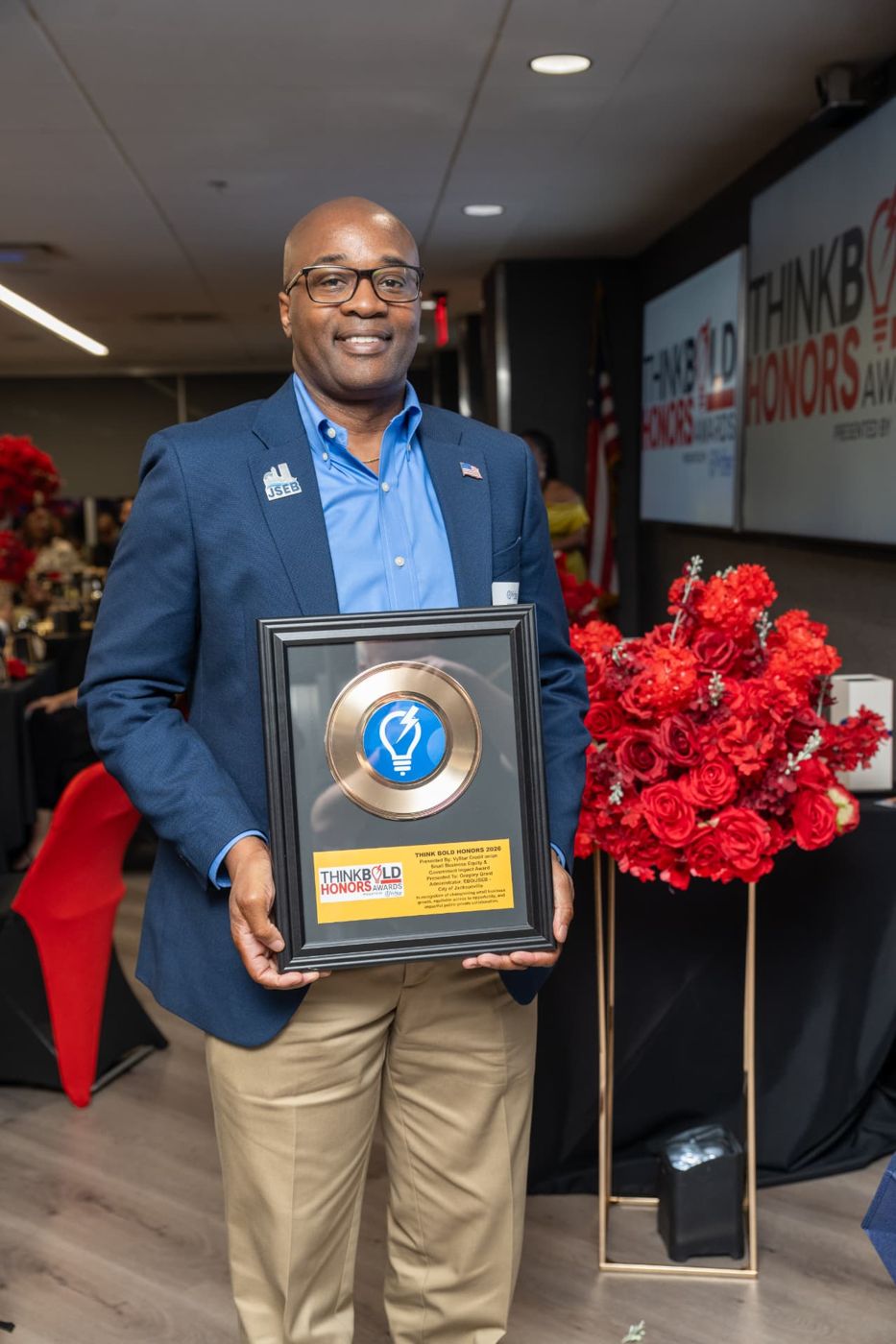 Gregory Grant receiving the Small Business Equity & Government Impact Award