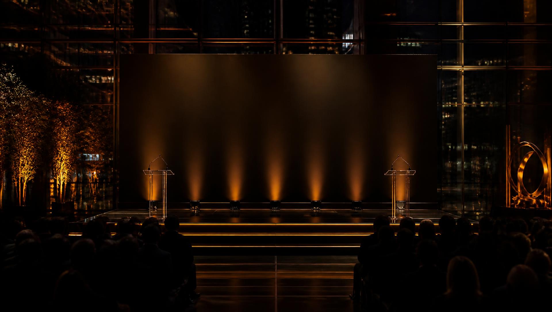 An awards stage lit in warm light before the ceremony begins